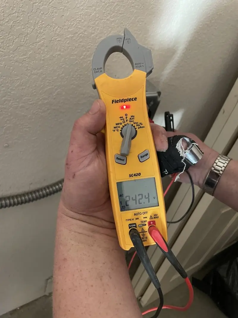 Voltage testing with clamp meter during Ceiling Fan Installation in Chanceford